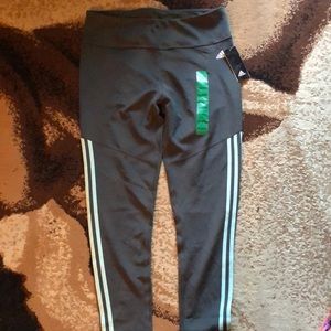 Exercise pants. They’re grayish and teal